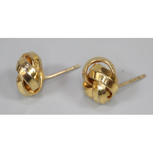 247 - Pair of yellow metal knot earrings.  (B.P. 21% + VAT)