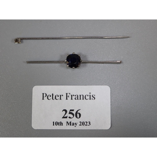 256 - Sapphire bar brooch set in white metal.  Pin detached.
Approx weight 3.1 grams.
(B.P. 21% + VAT)