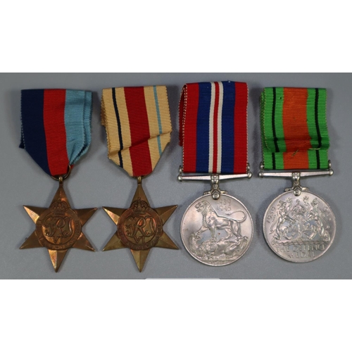 293 - WWII Medal group, to include: 1939-45 War Medal, Defence Medal, 1939-45 Star and Africa Star.  Belie... 