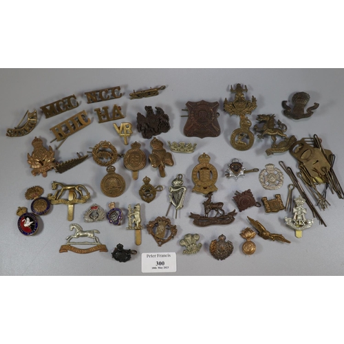 300 - Collection of assorted Military cap badges and other insignia, including:  Monmouthshire Regiment, S... 