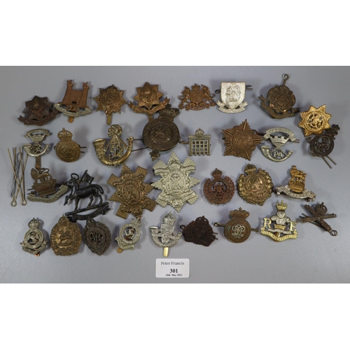 301 - Large collection of British Military cap badges, including: The Royal Dragoons, Cheshire Regiment, S... 