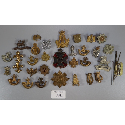 304 - Bag of assorted British Military cap badges, various: Fusiliers and others.  (B.P. 21% + VAT)