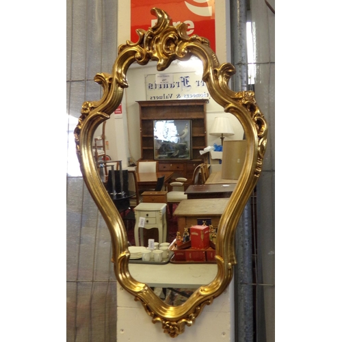 497 - Small Rococo style gilt framed mirror (modern).  70cm high approx.  (B.P. 21% + VAT)