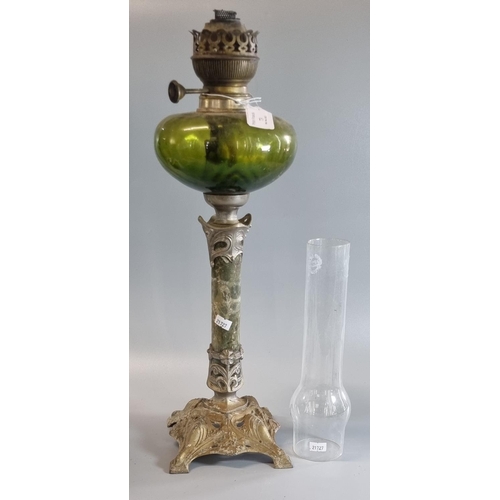 73 - Early 20th century single burner oil lamp having green glass reservoir standing on a white metal WMF... 