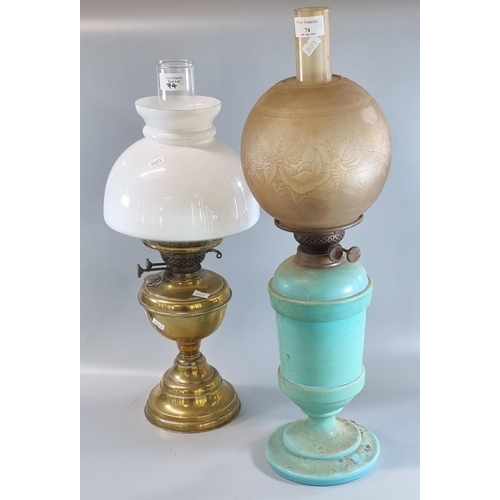 74 - Two double burner oil lamps, one on a turquoise opaline glass reservoir and base.  (2)  (B.P. 21% + ... 