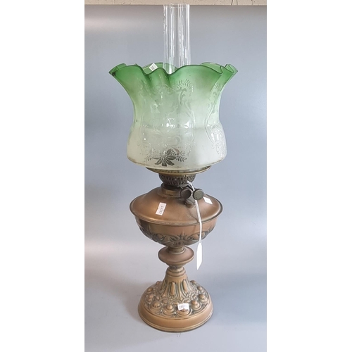 82 - Early 20th century double  burner oil lamp having frosted green glass shade on a copper reservoir an... 