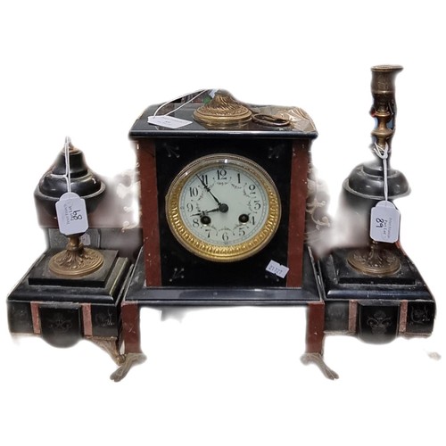 89 - Early 20th century gilt metal and black slate clock garniture, the two train clock with urn pediment... 