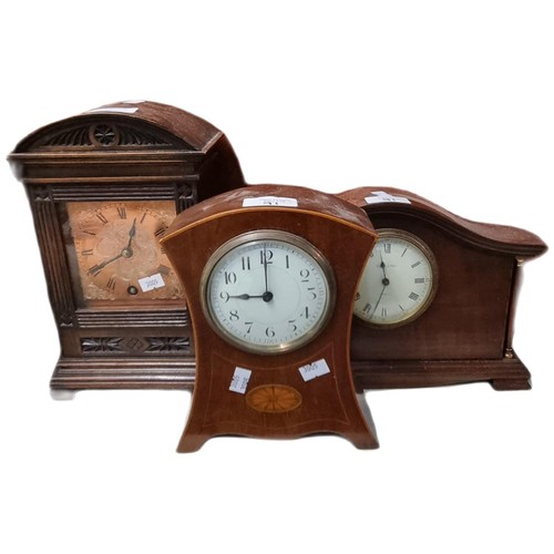 91 - Group of assorted Edwardian and other mantle clocks: balloon shaped, inlaid mahogany etc.  (3)   (B.... 