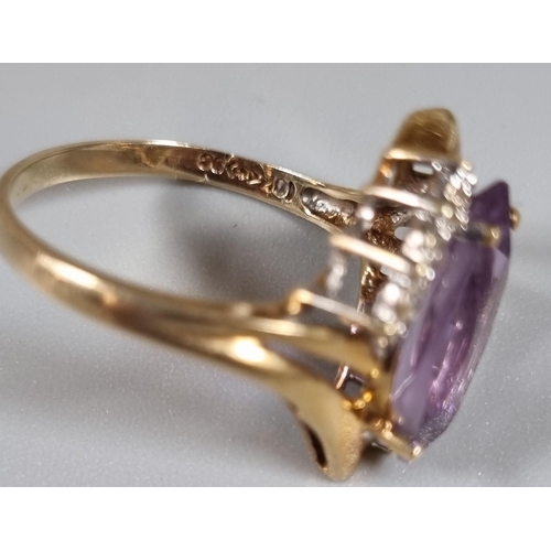 230 - 10ct gold diamond and purple stone ring.  3.4g approx.  Ring size Q.   (B.P. 21% + VAT)