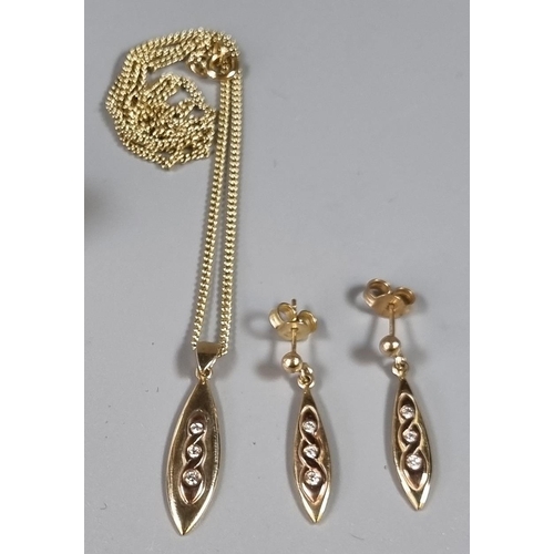 237 - 9ct gold oval and diamond pendant on chain with a pair of matching earrings.  Total weight 8.5g appr... 