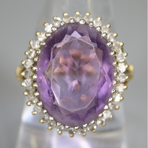 241 - 18ct gold amethyst and diamond ring.  Size O.  7g approx.