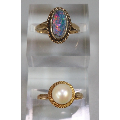 246 - Two yellow metal dress rings, one with opal stone.  3.2g approx.   (B.P. 21% + VAT)