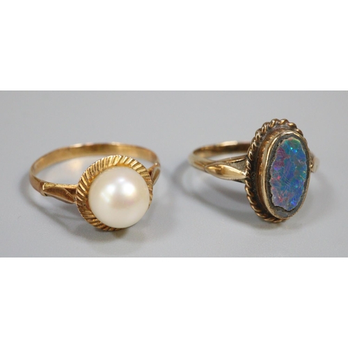 246 - Two yellow metal dress rings, one with opal stone.  3.2g approx.   (B.P. 21% + VAT)