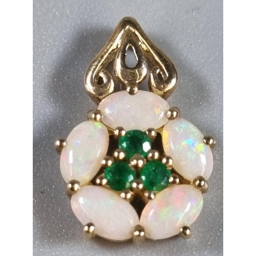 247 - Fine yellow metal chain together with a 9ct gold opal and emerald flowerhead pendant.  Total weight ... 