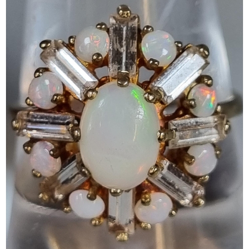 252 - 9ct gold opal flow head design ring.  3.6g approx.  Ring size P.   (B.P. 21% + VAT)