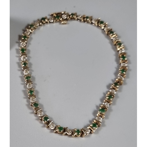 253 - 9ct gold green and white stone bracelet.  6.4g approx.     (B.P. 21% + VAT)