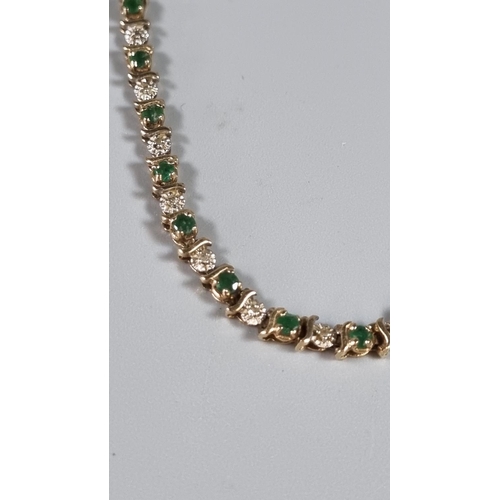 253 - 9ct gold green and white stone bracelet.  6.4g approx.     (B.P. 21% + VAT)