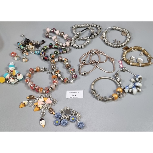 283 - Collection of charm bracelets, glass beaded charms etc.   (B.P. 21% + VAT)