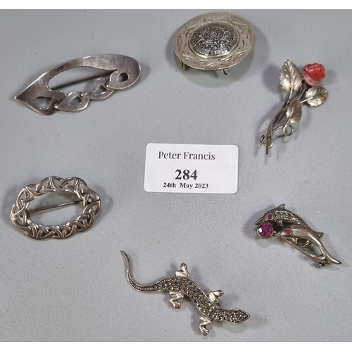 284 - Collection of six silver brooches, to include: marcasite lizard,  rose, dolphin etc.   (B.P. 21% + V... 