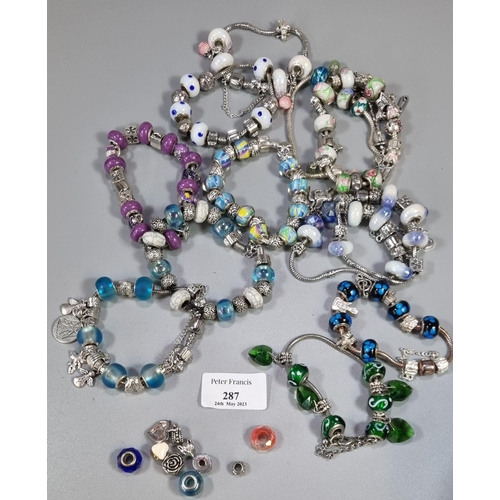 287 - Collection of charm bracelets, glass beaded charms etc.   (B.P. 21% + VAT)