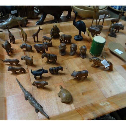 395 - Two trays of carved African and other wooden items, mostly animals to include: elephant bookends, li... 