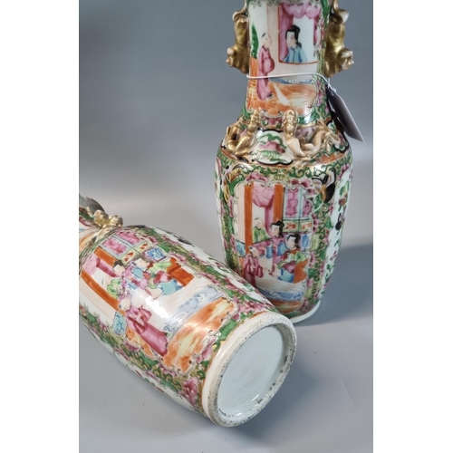 47 - Pair of Chinese porcelain Canton Famille Rose vases with alternating panels of figures in pavilions ... 