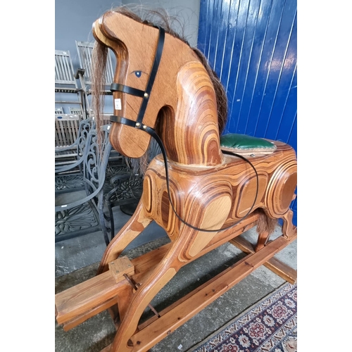 503 - Modern laminated wooden rocking horse with leather seat pad and bridal on swing frame.  Natural mane... 