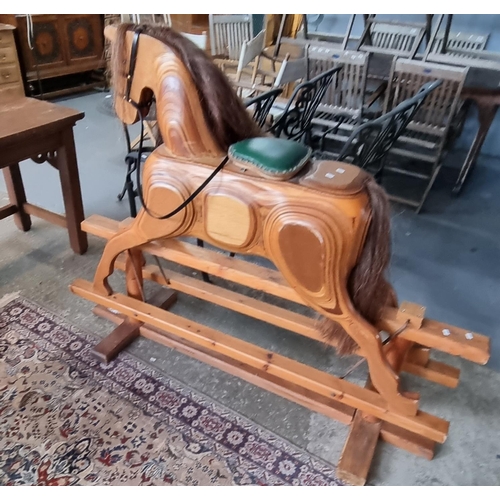 503 - Modern laminated wooden rocking horse with leather seat pad and bridal on swing frame.  Natural mane... 