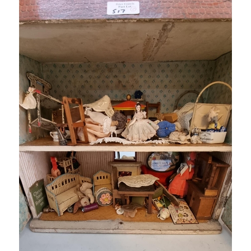 517 - Two mid 20th century Georgian style doll's houses containing an assortment of modern and other doll'... 