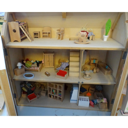 518 - Two modern doll's houses containing assorted furniture, figures and accessories.   (B.P. 21% + VAT)