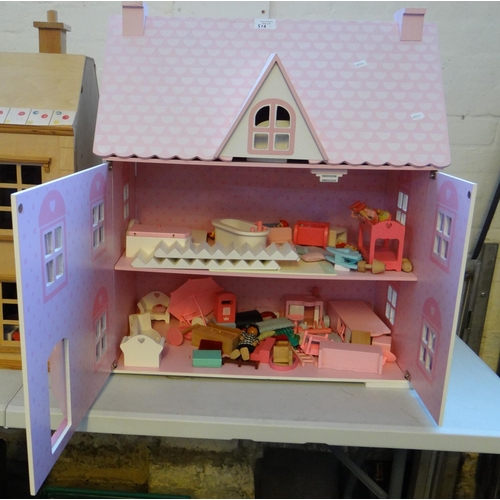 518 - Two modern doll's houses containing assorted furniture, figures and accessories.   (B.P. 21% + VAT)