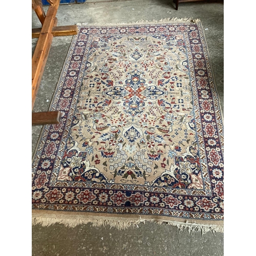 544 - Middle Eastern beige ground foliate design rug.  180x127cm approx.   (B.P. 21% + VAT)