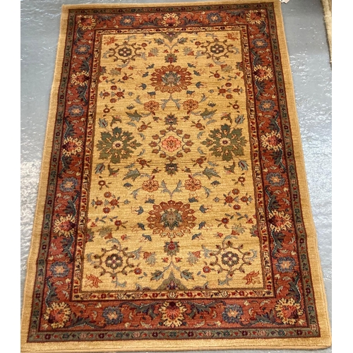 549 - Small Middle Eastern design beige ground floral and foliate multi coloured carpet.  100x146cm approx... 