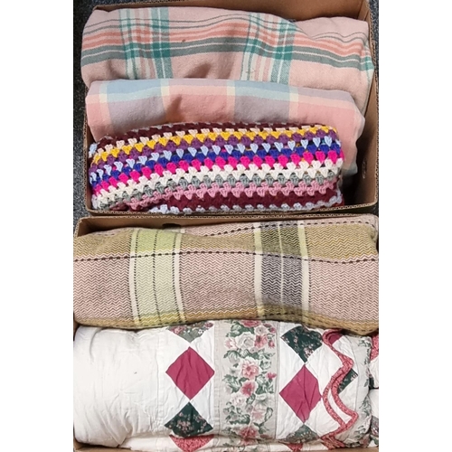 116 - Two boxes of textiles to include: three vintage woollen blankets or carthen with check design, a mul... 