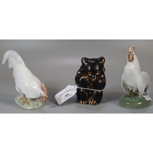 181 - Three Royal Copenhagen animal figures to include: two cockerels (1126 and 1127) and one standing bea... 