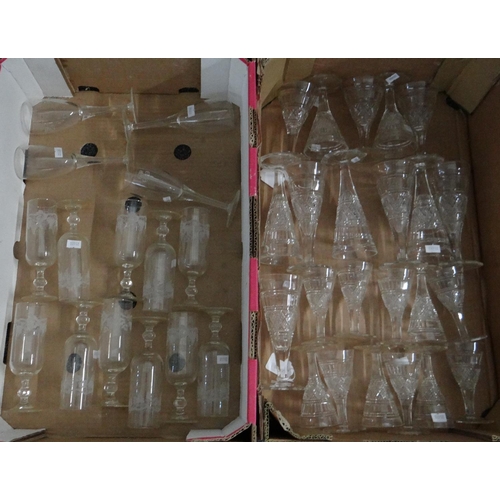 354 - Two boxes of glassware to include: moulded and etched glass drinking vessels, champagne flutes etc. ... 