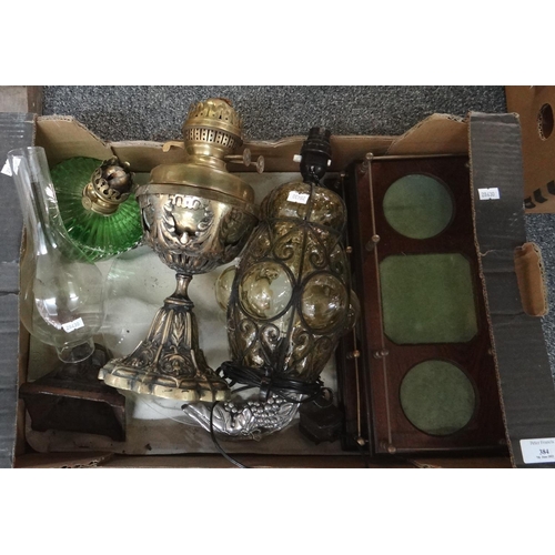 384 - Box of various items to include; oil lamps; one with fruit moulded cast metal base and green glass r... 