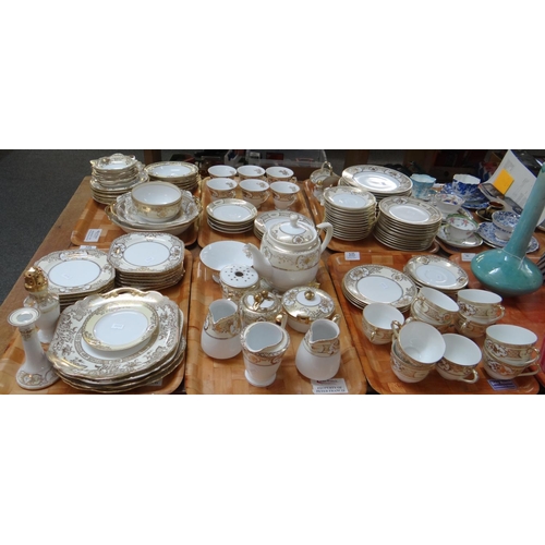 385 - Six trays of Noritake porcelain Japanese tea and dinnerware items on a white ground with gilded bouq... 