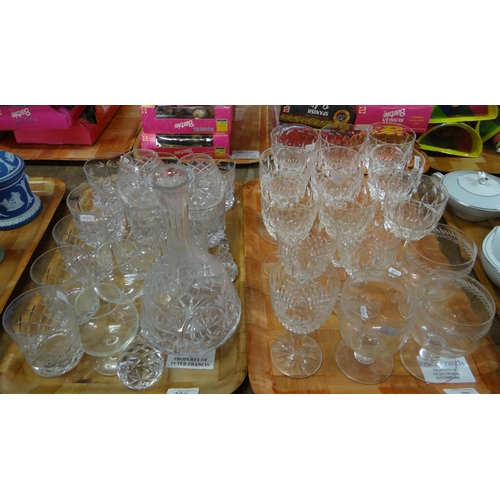 390 - Two trays of glassware to include: cut glass hock glasses, brandy balloons, whisky tumblers, decante... 