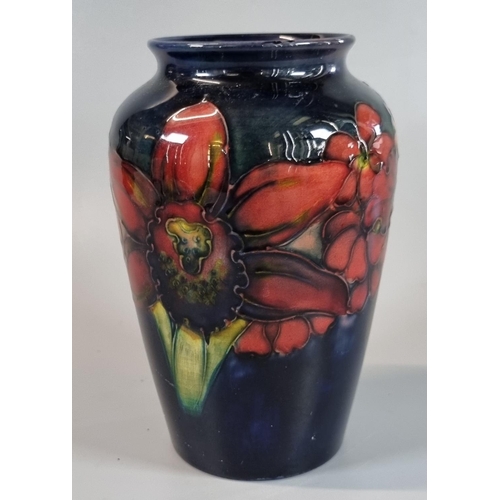 4 - Moorcroft pottery tube lined Orchid vase, impressed marks and signature to the underside.  16cm high... 