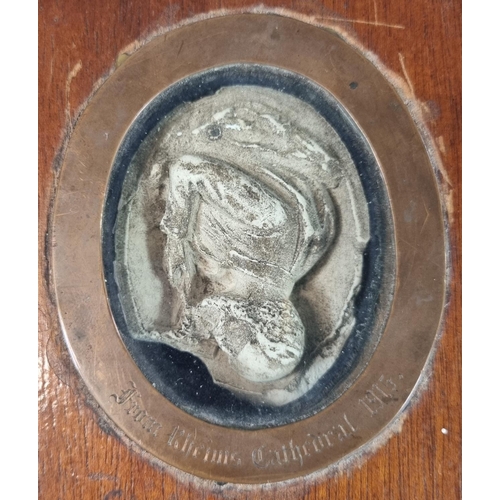 42 - Unusual WWI portrait relic in oak frame marked From Rheims Cathedral 1915.  (B.P. 21% + VAT)