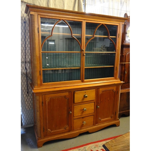 484 - Late Victorian pine two stage cabinet backed bookcase, the moulded cornice above two glazed doors, t... 