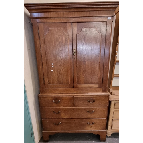 548 - 19th century oak two stage linen press, the moulded cornice above two blind panelled drawers, the in... 