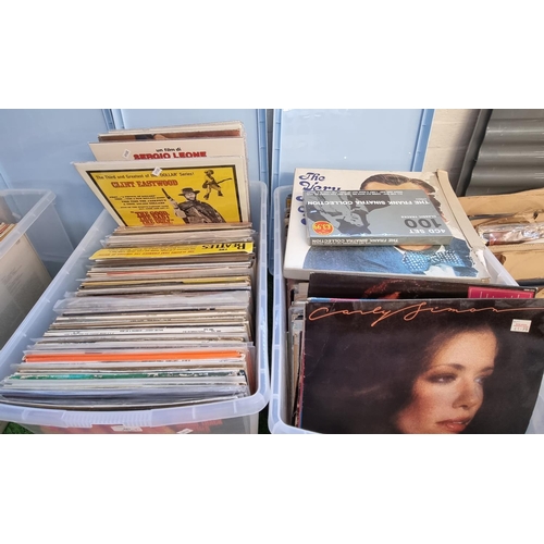 557 - Two boxes of vinyl LPs to include: The Beatles, Very Best of Bing, Carley Simon, Diana Ross, Johnny ... 