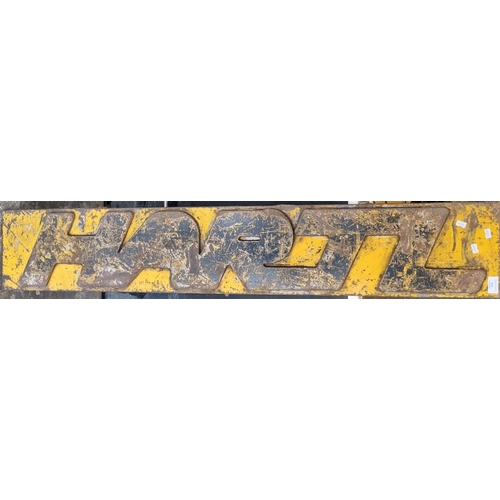 573 - Very heavy metal relief rectangular shaped sign reading 'Hartz'  130cm wide approx.  (B.P. 21% + VAT... 