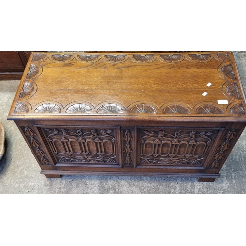 574 - 17th century style carved oak blanket box.   (B.P. 21% + VAT)