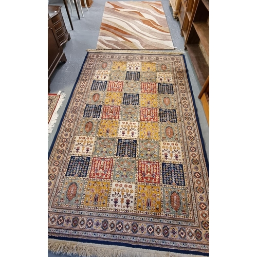 585 - Modern Persian style Area rug decorated with square panels of flowers and foliage together with anot... 