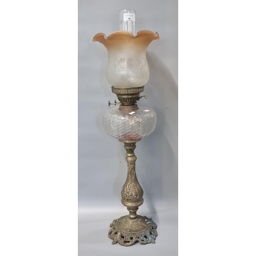 86 - Early 20th century double oil burner lamp having orange and frosted etched glass shade above a mould... 