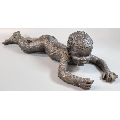 98 - Modern bronzed sculpture of a nude child lying down.  48cm long approx.   (B.P. 21% + VAT)