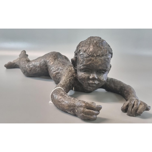 105 - Modern bronzed sculpture of a baby lying down.  48cm long approx.   (B.P. 21% + VAT)